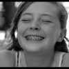 Girl smiling with orthodontic braces